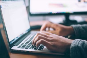 man talking online on computer