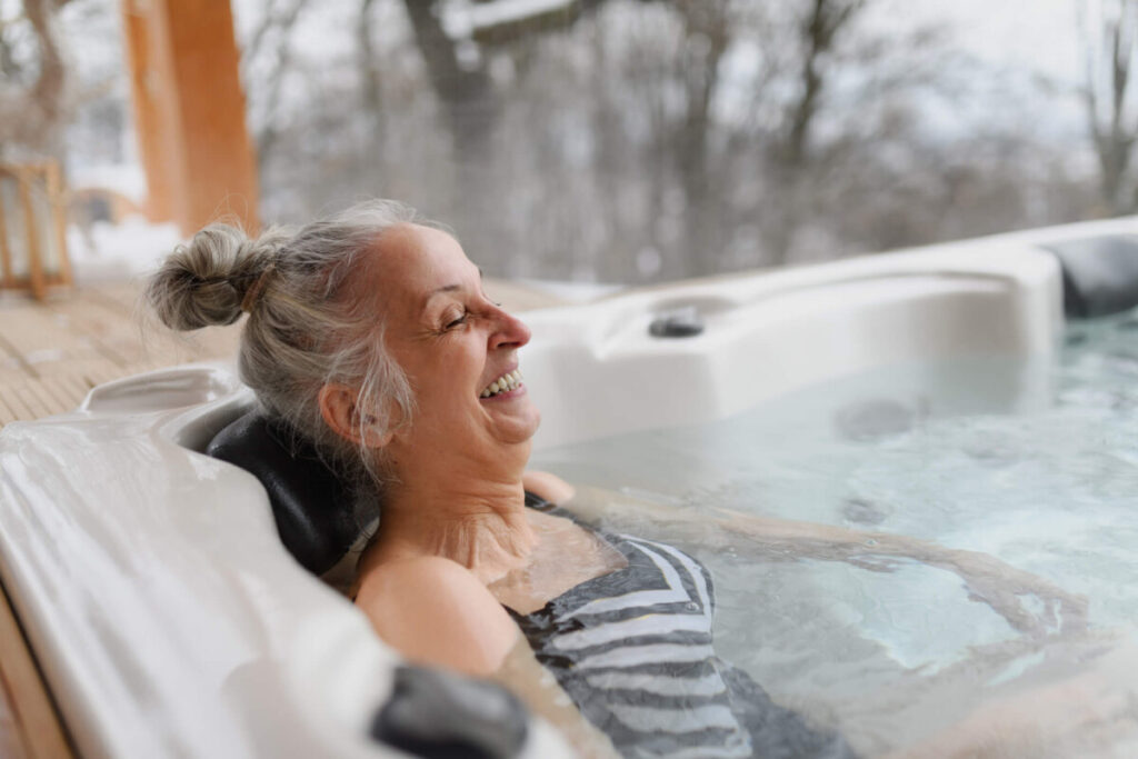 elderly woman benefitting from hydrotherapy in a jacuzzi
