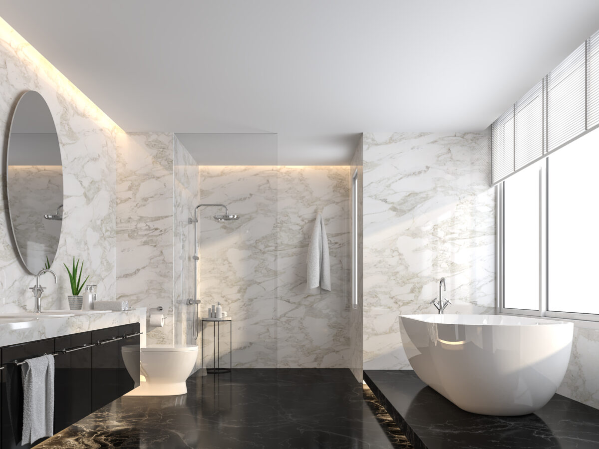 A luxurious modern bathroom with black marble flooring and LED lighting.