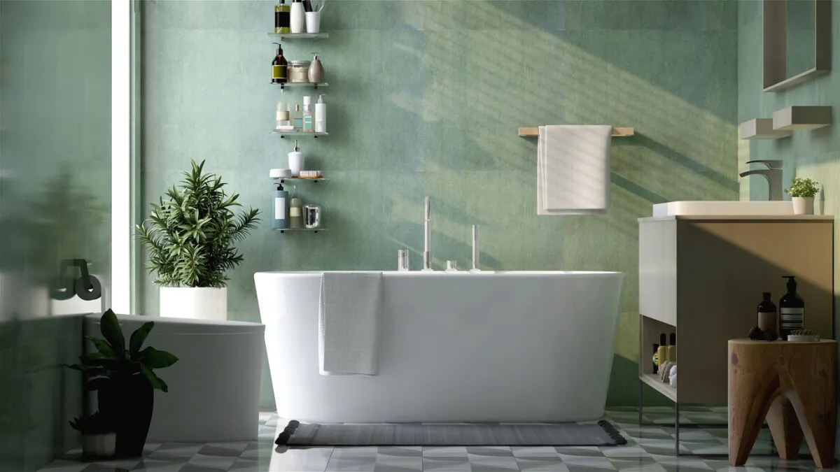 Modern luxury bathroom with freestanding bathtub, toilet, vanity washbasin, and open shelving in a green colour scheme.