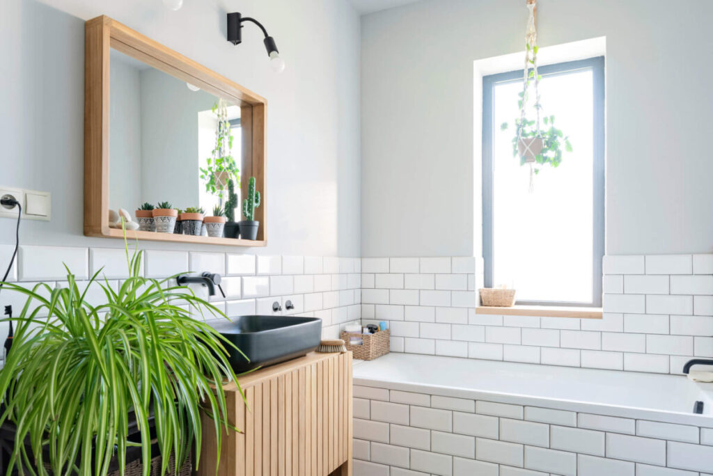 Home interior with bath , wooden countertop and brick wall. 