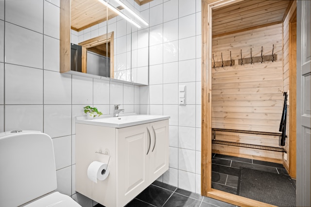 An image of a bathroom with a walk in sauna